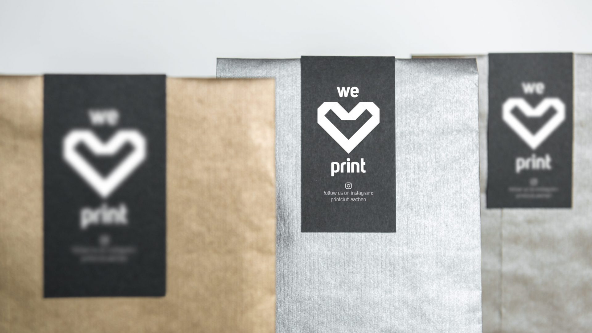 Three metallic gift packaging mockups